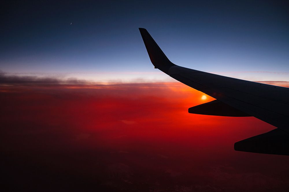 Aerial sunset view from airplane window above California, USA